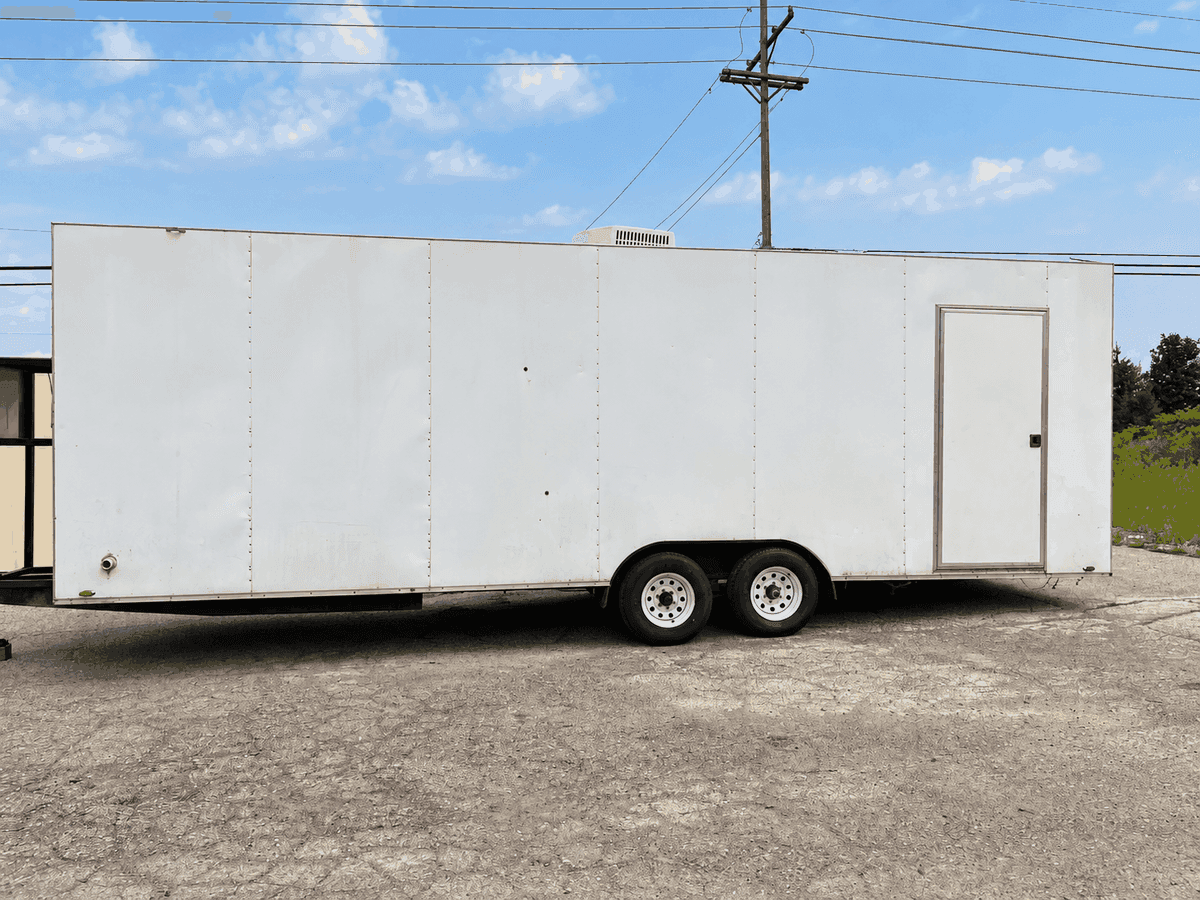 Commercial dishwashing trailer interior with warewashing equipment