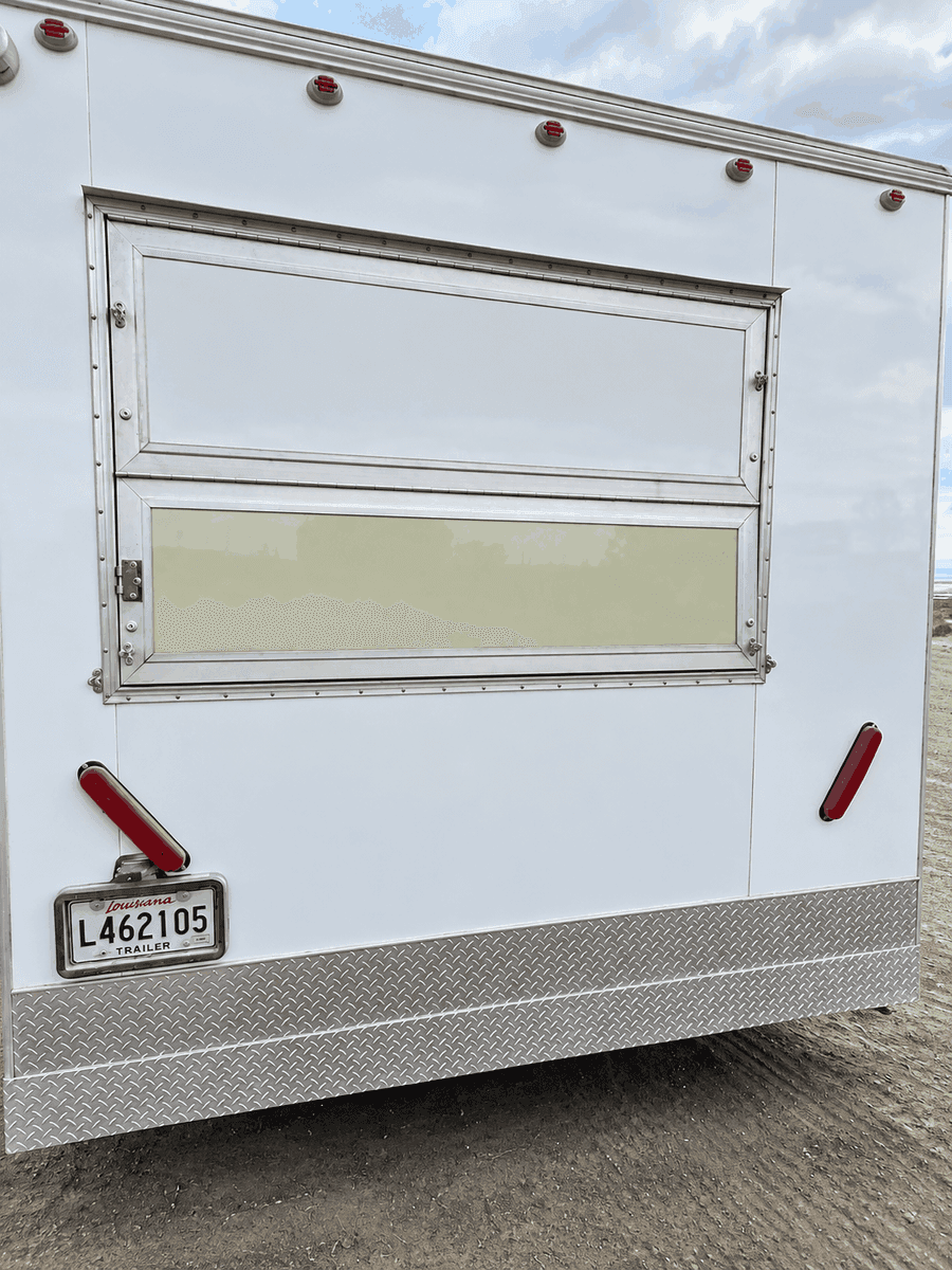 Mobile commercial kitchen trailer exterior with service window